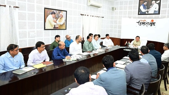 Uttarakhand Chief Minister Pushkar Singh Dhami chairs a meeting before unveiling the 'Solar Awareness Souvenir Booklet' prepared by the Council on Energy, Environment and Water (CEEW), at the Chief Minister's Camp Office, in Dehradun on Thursday. (@pushkardhami)