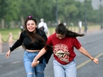 People enjoy during a heavy rain at Kartavya path, in New Delhi, India, May 30, 2026. 