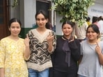 First-time voters showing their inked fingers after exercising their franchise at Gumma panchayat in Shimla district on Saturday. (HT Photo)