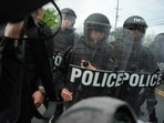 Police push into the crowd to disperse people outside the Delaney Hall detention center on Saturday, May 30, 2026, in Newark, New Jersey.