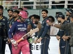 Gujarat Titans' captain Shubman Gill with teammates watches as Rajasthan Royals' Vaibhav Sooryavanshi walks in. 