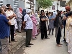 Kin of the victims outside their residence in Janta Nagar, Ludhiana, on Saturday. (Manish/HT)