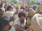Police stop Congress leaders and workers from entering the counting centre in Amritsar on Friday. (Sameer Sehgal/HT)