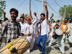 Supporters of AAP candidates celebrating outside a counting centre in Bathinda on Friday. (Sanjeev Kumar/HT)