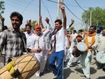 Supporters of AAP candidates celebrating outside a counting centre in Bathinda on Friday. 