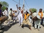 Supporters of candidates dance outside the counting station and celebrate after the Bathinda Municipal Corporation election results are announced on Friday. (Sanjeev Kumar / HT)