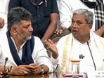 Flanked by deputy CM DK Shivakumar, Karnataka chief minister Siddaramaiah addresses a press conference after submitting his resignation to the governor’s office on Thursday
