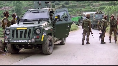 Army, J&K Police and CRPF personnel carry out a cordon and search operation in the dense forest areas of Gambhir Mughal and Dorimal at Manjakote sector, in Rajouri on Saturday. (ANI Video Grab)