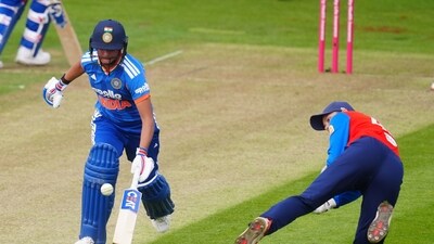 England's Amy Jones attempts to run out India's Harmanpreet Kaur. (David Davies/PA via AP) England's Amy Jones attempts to run out India's Harmanpreet Kaur. (David Davies/PA via AP)