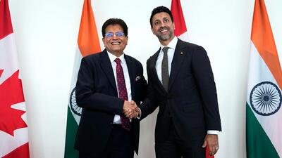 Canada's Minister of International Trade Maninder Sidhu (right) and India's Minister of Commerce and Industry Piyush Goyal shake hands after making remarks before a bilateral meeting in Ottawa, on May 25. (AP)