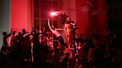 PSG supporters celebrate their team's win at Place du Trocadero opposite the Eiffel Tower in Paris (Photo by LOU BENOIST / AFP) PSG supporters celebrate their team's win at Place du Trocadero opposite the Eiffel Tower in Paris (Photo by LOU BENOIST / AFP)