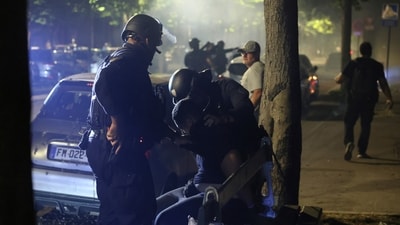 Police try to disperse PSG supporters who left off fireworks as they celebrate in Paris. (AP Photo/Thomas Padilla) (AP Photo/Thomas Padilla) Police try to disperse PSG supporters who left off fireworks as they celebrate in Paris. (AP Photo/Thomas Padilla) (AP Photo/Thomas Padilla)