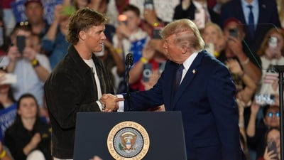 NFL quarterback Jaxson Dart, with the New York Giants, left, introduces President Donald Trump during a Fighting For American Workers event, Friday, May 22, 2026, in Suffern, N.Y. (AP Photo/Ryan Murphy) (AP Photo/Ryan Murphy)
