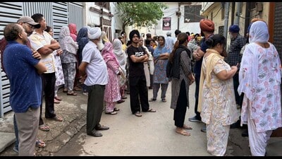 Kin of the victims outside their residence in Janta Nagar, Ludhiana, on Saturday. (Manish/HT)
