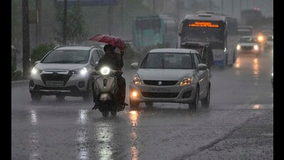 People make their way amid showers in Ludhiana on Saturday; and (right) residents wade through a waterlogged street on Rahon Road. (Gurpreet Singh/HT) People make their way amid showers in Ludhiana on Saturday; and (right) residents wade through a waterlogged street on Rahon Road. (Gurpreet Singh/HT)