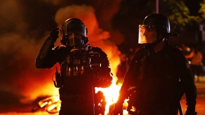Police officers in the streets after Paris St Germain won the UEFA Champions League&nbsp; (REUTERS/Abdul Saboor)