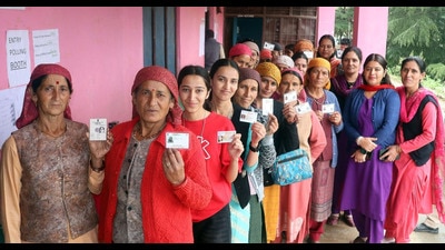 Voters showing their identity cards at a polling station in Mandi district on Saturday. (Birbal Sharma) Voters showing their identity cards at a polling station in Mandi district on Saturday. (Birbal Sharma)