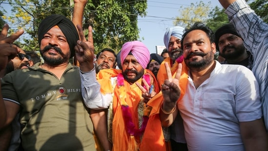 Aam Aadmi Party's candidate from Majitha's Ward No. 3, Amarjit Singh, celebrates his win in the Punjab civic body elections, in Amritsar. (ANI Photo/Raminder Pal Singh) (Raminder Pal Singh)