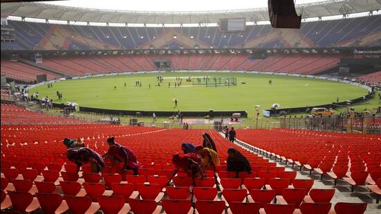 Support staff sweeps the stands ahead of the IPL final between RCB and GT in Ahmedabad on Sunday. (PTI)