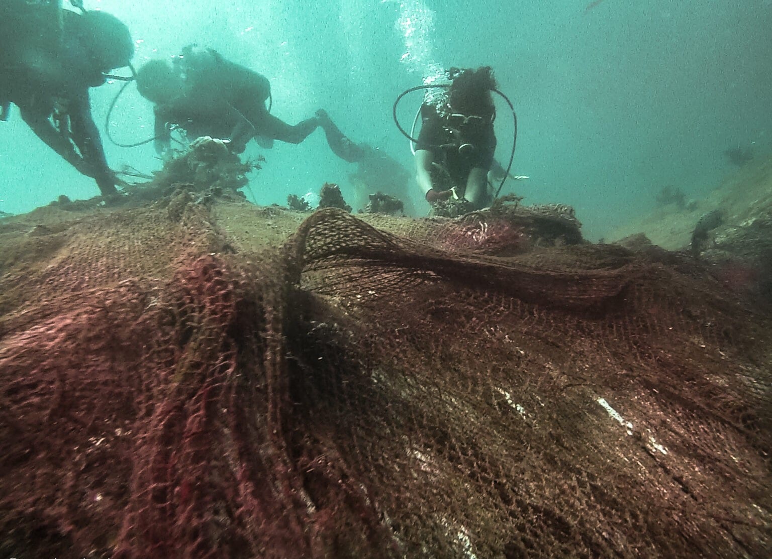 Divers with Sri Lanka’s Pearl Protectors work to free corals of abandoned nets. (The Pearl Protectors) Divers with Sri Lanka’s Pearl Protectors work to free corals of abandoned nets. (The Pearl Protectors)
