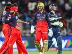 Krunal Pandya and his RCB teammates celebrate Jos Buttler's dismissal.