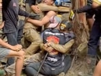 Rescue operations will continue as two men remain trapped in a semi-submerged cave 