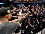 San Antonio Spurs forward Victor Wembanyama walks over to Spurs fans as he holds his MVP trophy as he celebrates after Game 7 of the Western Conference finals of the NBA basketball playoffs series win against the Oklahoma City Thunder, May 30, in Oklahoma City. San Antonio Spurs forward Victor Wembanyama walks over to Spurs fans as he holds his MVP trophy as he celebrates after Game 7 of the Western Conference finals of the NBA basketball playoffs series win against the Oklahoma City Thunder, May 30, in Oklahoma City.