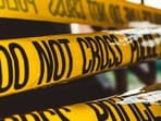 The toddler's body reportedly bore numerous healed scars from earlier injuries.