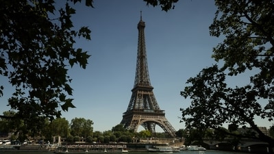 A tourist boat passes by the Eiffel Tower during a sunny day in Paris, Wednesday, May 27. (AP Photo/Thomas Padilla) A tourist boat passes by the Eiffel Tower during a sunny day in Paris, Wednesday, May 27. (AP Photo/Thomas Padilla)