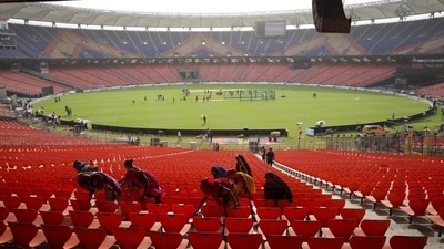 Support staff sweeps the stands ahead of the IPL final between RCB and GT in Ahmedabad on Sunday. (HT_PRINT) Support staff sweeps the stands ahead of the IPL final between RCB and GT in Ahmedabad on Sunday. (HT_PRINT)