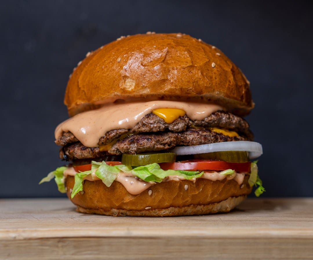 Eating a burger once in a while, when you are busy, won’t define your entire weight loss journey. (Unsplash) Eating a burger once in a while, when you are busy, won’t define your entire weight loss journey. (Unsplash)