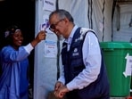 Director-General of the World Health Organisation (WHO) Tedros Adhanom Ghebreyesus has his temperature checked as he tours CEM, during his visit to coordinate the response to the Ebola outbreak, as agencies intensify efforts to contain a new Ebola outbreak caused by the Bundibugyo virus strain, in Bunia, Ituri province, Democratic Republic of Congo.