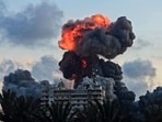 A fireball and smoke erupt from a building following an Israeli strike in Tyre, southern Lebanon. A fireball and smoke erupt from a building following an Israeli strike in Tyre, southern Lebanon.