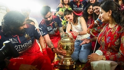Virat Kohli and Anushka Sharma with the IPL trophy after RCB won the Indian Premier League 2026 Final against Gujarat Titans at Narendra Modi Stadium, in Ahmedabad on Sunday. (ANI Photo) (ANI Pic Service)