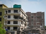 A view of the site where a four-storey building collapsed in Saidulajab in New Delhi on Saturday. (Sanchit Khanna/HT Photo)