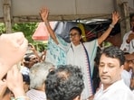 Former West Bengal chief minister and TMC chief Mamata Banerjee raises hands during a protest rally at Esplanade, in Kolkata on Tuesday.