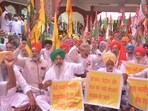 Farmers holding protest against the rising prices of petrol, LPG and other essential commodities outside the deputy Commissioner's office in Amritsar on Tuesday. (Sameer Sehgal/HT)