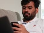 Abhijeet Dipke, head of the Cockroach Janta Party (CJP), who says he works mostly from his sister's couch, poses for a portrait at an undisclosed location in the US May 29, 2026.