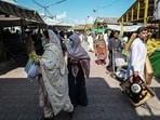 People buy vegetables at government-subsidised rates at a Sunday market in Islamabad,