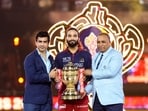 Rajat Patidar, Mitun Manhas and Devajit Saikia with the IPL trophy.