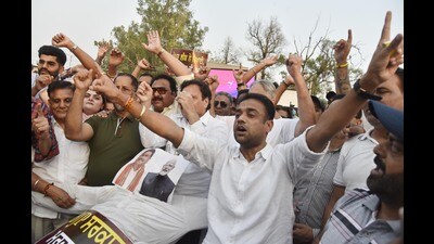 Congress workers raising slogans against Prime Minister Narendra Modi and Union education minister Dharmendra Pradhan in Amritsar on Tuesday. (Sameer Sehgal/HT) Congress workers raising slogans against Prime Minister Narendra Modi and Union education minister Dharmendra Pradhan in Amritsar on Tuesday. (Sameer Sehgal/HT)