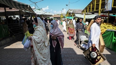 People buy vegetables at government-subsidised rates at a Sunday market in Islamabad, (AFP) People buy vegetables at government-subsidised rates at a Sunday market in Islamabad, (AFP)