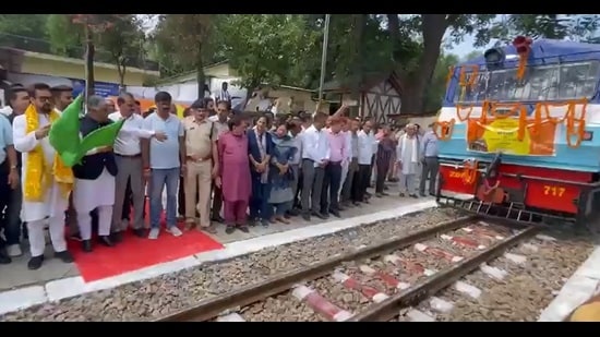 Hamirpur MP Anurag Thakur flagging off the train in Kangra on Tuesday. (HT Photo)