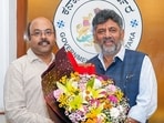 Former Karnataka Chief Minister Siddaramaiah's son Yathindra Siddaramaiah, meets Chief Minister-designate DK Shivakumar, in Bengaluru on Sunday. 