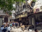 Media personnel at the site where a fire broke out in a restaurant at Malviya Nagar, in New Delhi on Wednesday. Media personnel at the site where a fire broke out in a restaurant at Malviya Nagar, in New Delhi on Wednesday.