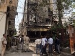 New Delhi, Jun 03 (ANI): Police personnel at a site fire in a restaurant at Malviya Nagar, in New Delhi on Wednesday. 21 people died so far. (ANI Photo/Sumit)