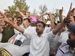 Congress workers raising slogans against Prime Minister Narendra Modi and Union education minister Dharmendra Pradhan in Amritsar on Tuesday. (Sameer Sehgal/HT)