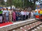 Hamirpur MP Anurag Thakur flagging off the train in Kangra on Tuesday. (HT Photo)