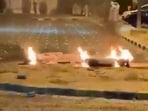 Debris burns on the ground in a parking lot following reports of missile and drone attacks, in Sabah Al Nasser, Kuwait.