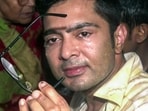 TMC MP Abhishek Banerjee shows his broken glasses to media after being roughed up by unidentified people during a visit to Sonarpur to meet the post-poll violence victims' families, in Sonarpur on Saturday. (ANI Video Gr)